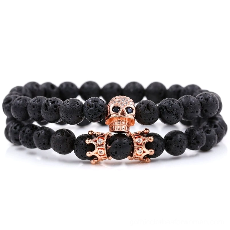Rose gold tone skull and crown beaded gothic bracelet with black lava stone beads, studio photography