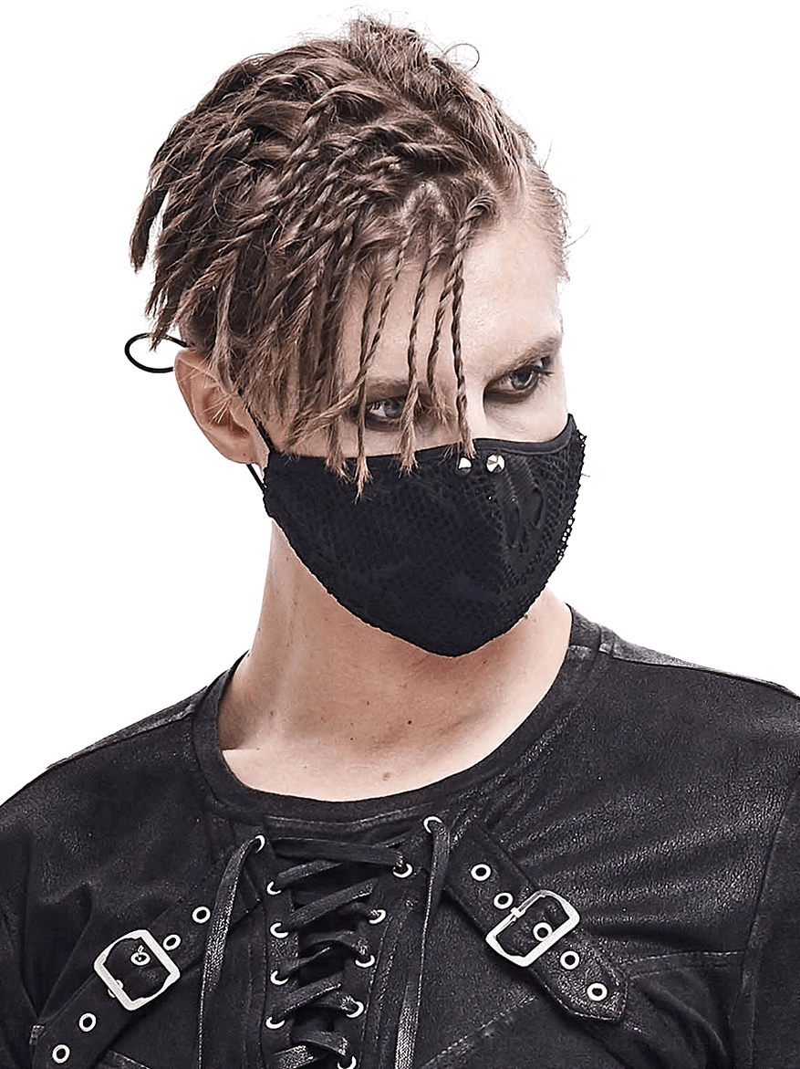 Gothic skeleton mesh face mask worn by male model in black leather punk outfit showing upper body styling