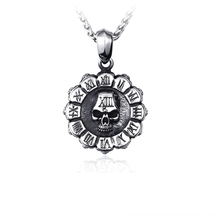 Front product shot of polished stainless steel skull pendant necklace with compact round design, displayed on reflective white background