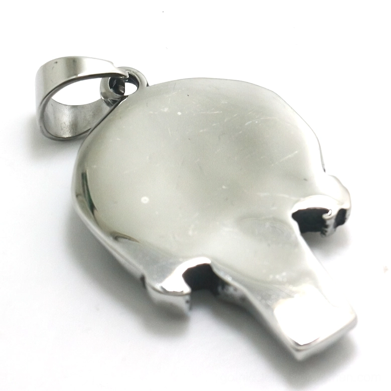Memento mori skull necklace pendant back view displaying smooth solid silver reverse surface and secure bail attachment