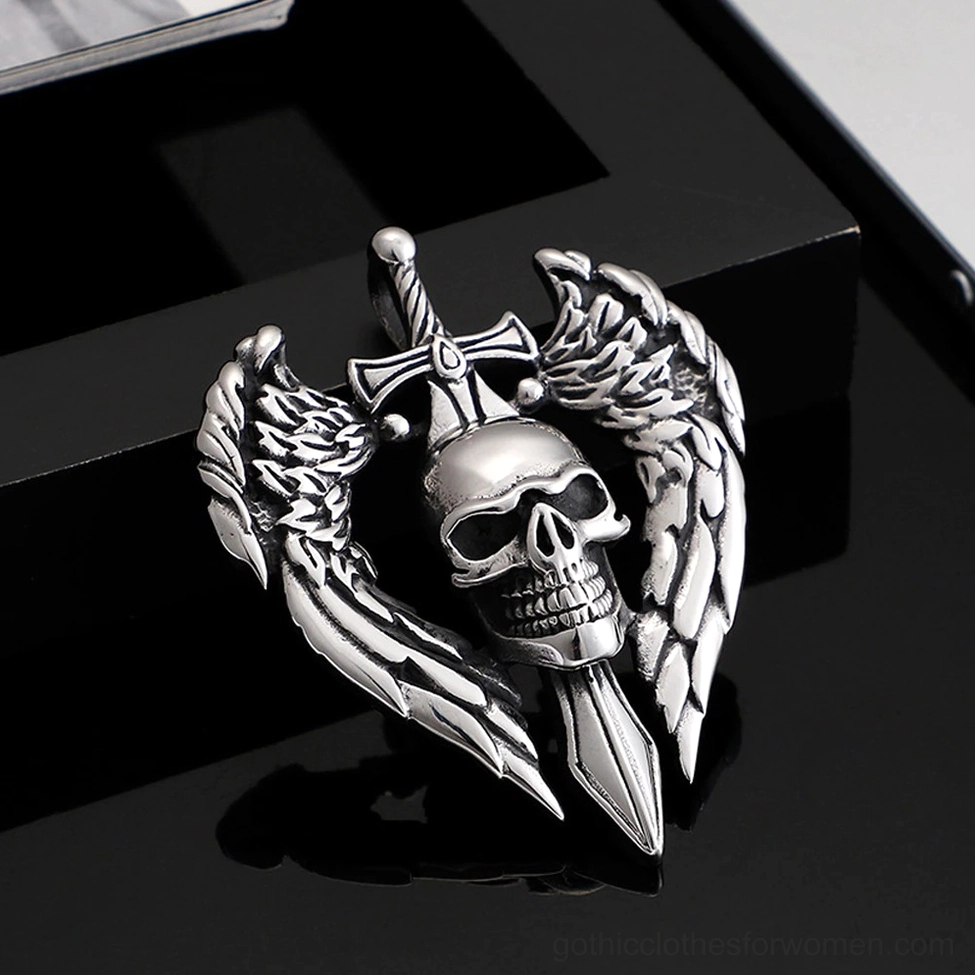 Gothic winged skull pendant on glossy black display stand showing reflection and dimensional design