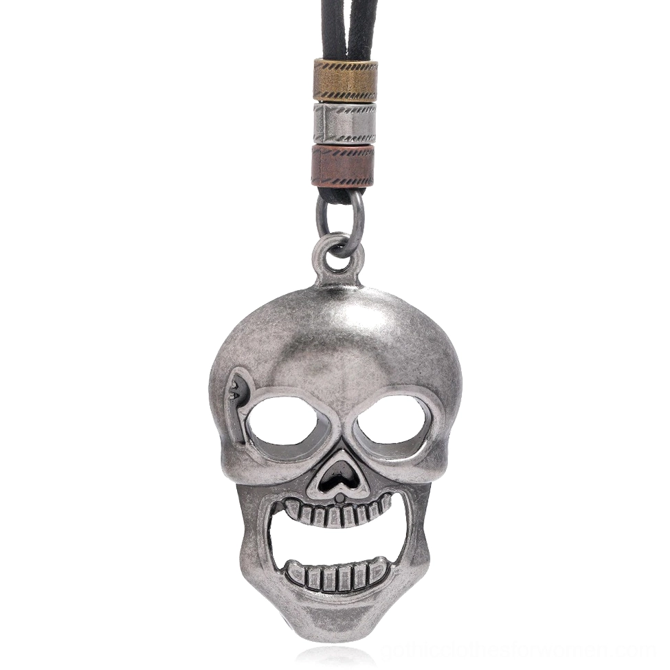 Antique silver skull pendant on genuine leather cord, front close-up view showing carved skull details and metal beads