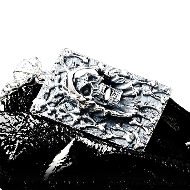 Sterling silver gothic pendant reverse side angle view displaying carved bone border and dark aesthetic design