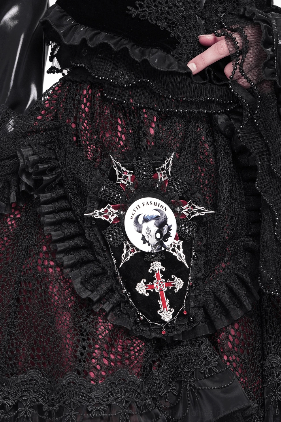 Gothic horned skull pin badge styled on black leather jacket with gothic fashion ensemble and lace details