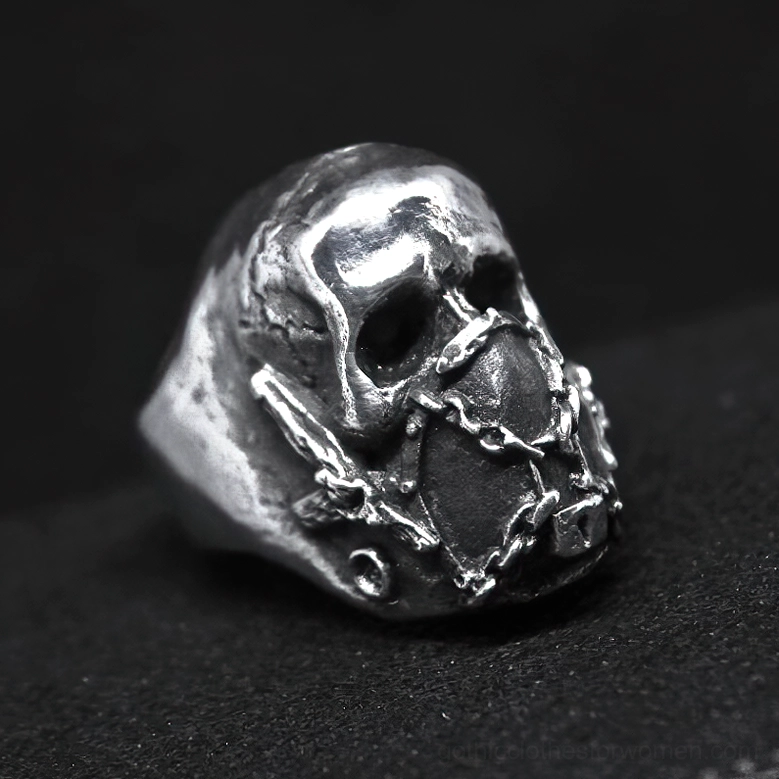 Three-quarter angled gothic skull ring showcasing chain mask design and skull carving details