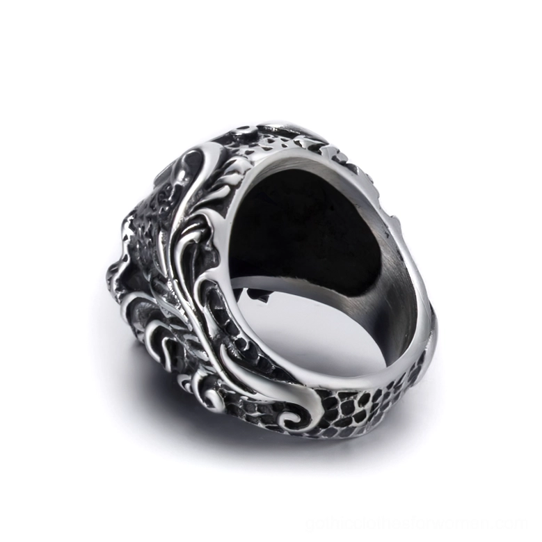 Bottom interior view of gothic skull ring showing smooth inner band and scaled lower band with floral scroll engravings
