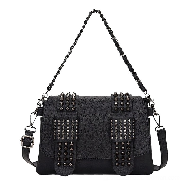 Gothic skull rivet crossbody bag front view - embossed leather with metal rivet details and dual carrying straps