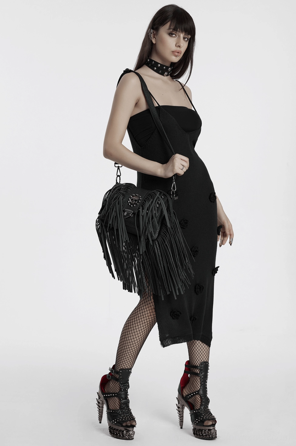 Black gothic skull tassel handbag with 3D skull rivets, cascading fringe, and ornamental lock clasp