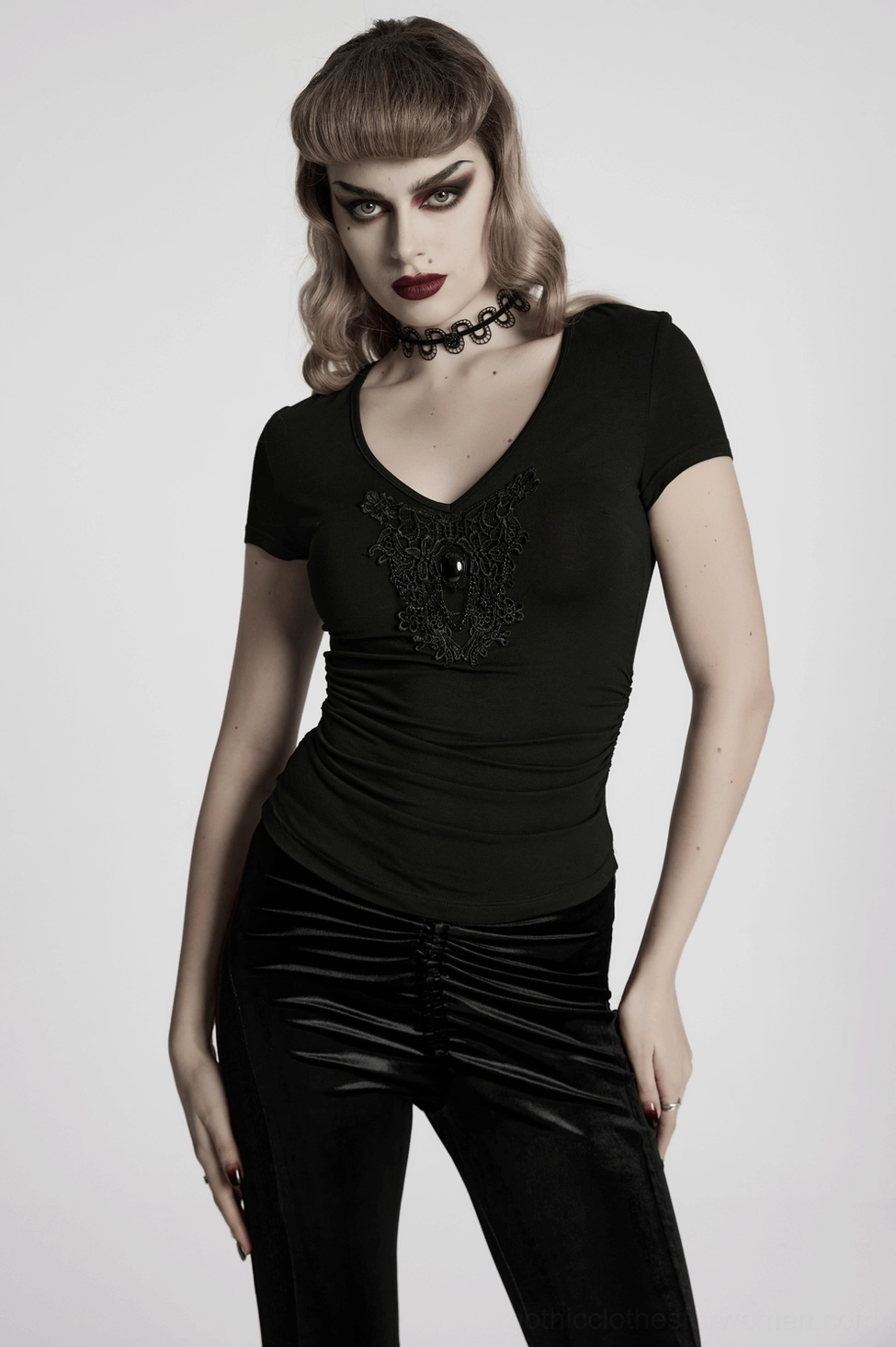 Black gothic t-shirt with skull and lace motif styled on model wearing XS-S size