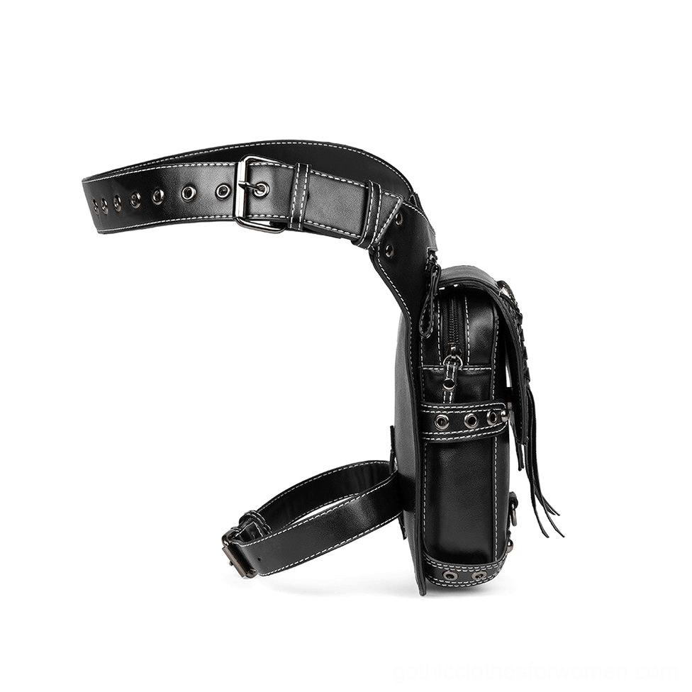 Gothic skull leather waist bag side profile showing tassel detail and zippered pocket