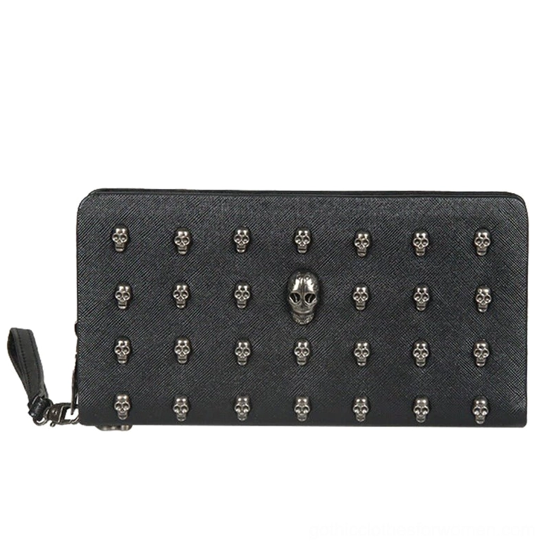 Front view of black PU leather gothic wallet featuring grid pattern of silver skull studs, prominent central skull ornament, and secure zipper closure