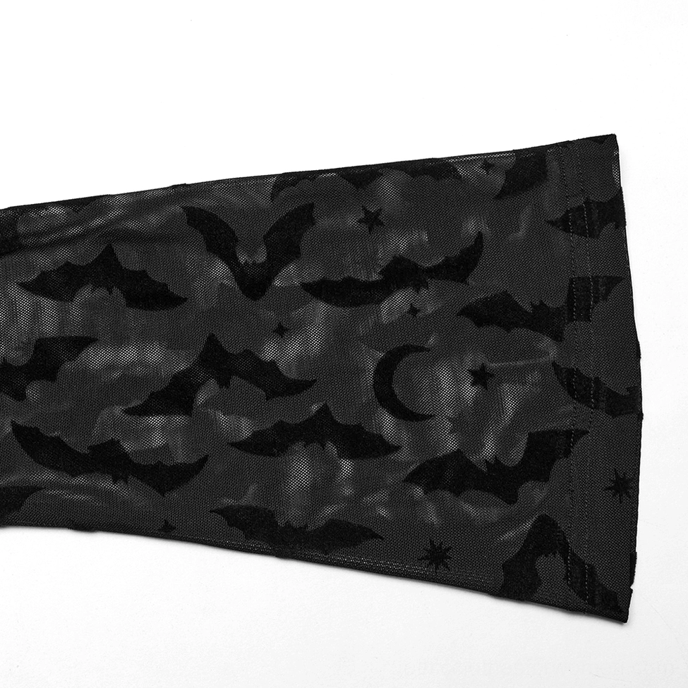 Sleeve panel close-up of black gothic mesh top showing flocked bat moon and star celestial print design
