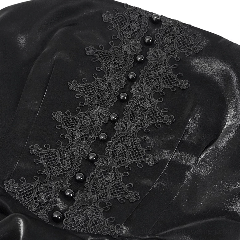 Close-up detail of gothic black slip dress showing embroidered lace trim and decorative button accents