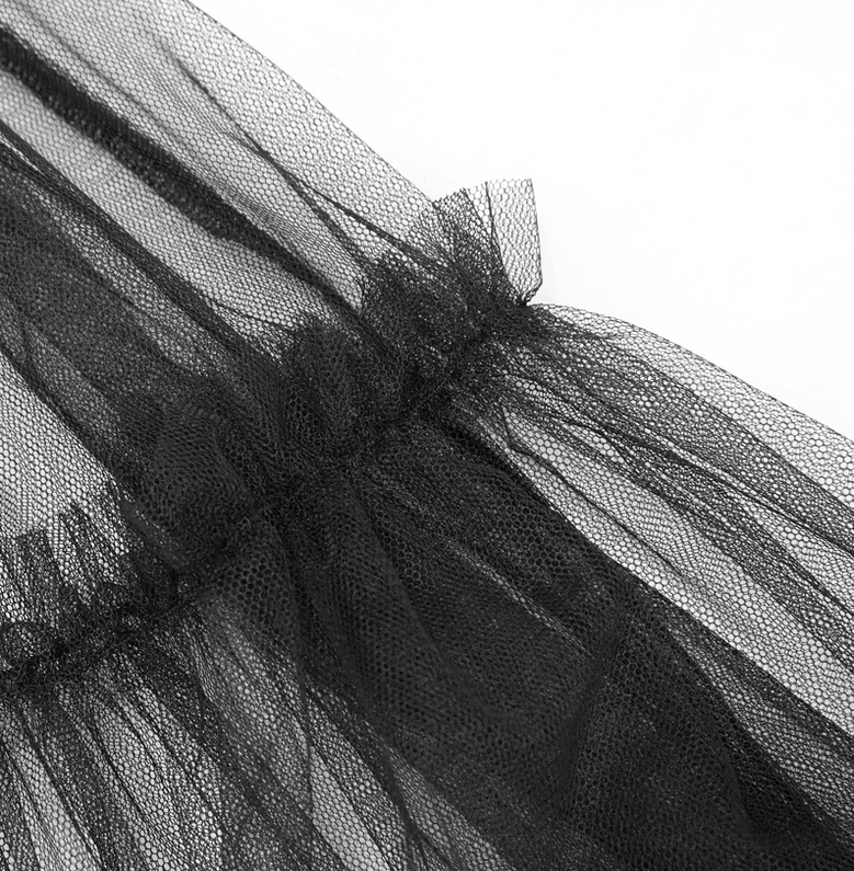 Detail shot of sheer black tulle mesh hem with gathered ruffled lace edge on gothic slip dress