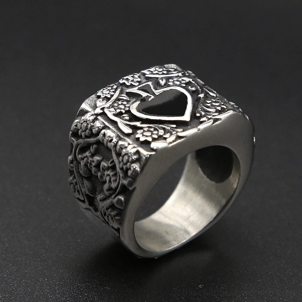 Vintage spade gothic ring three-quarter oblique angle with black enamel spade and dense floral engraving
