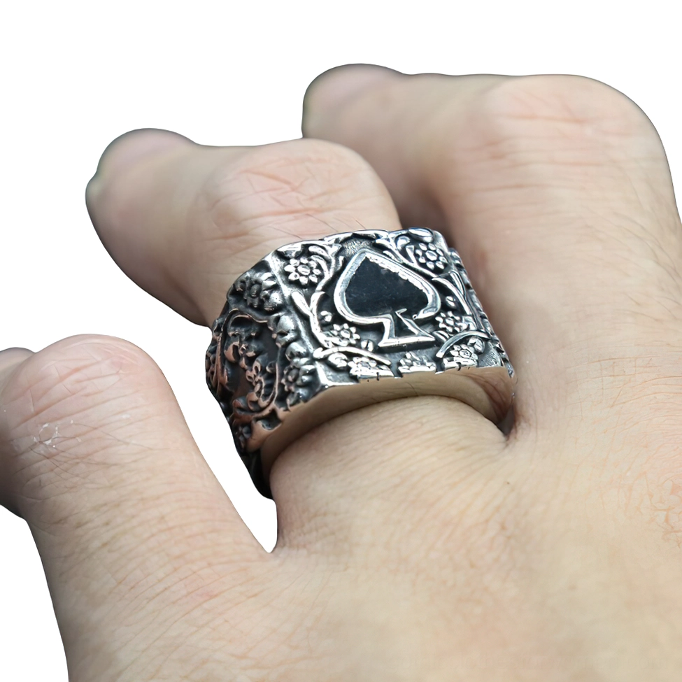 Vintage spade gothic ring worn on male hand index finger showing aged silver tone and authentic styling