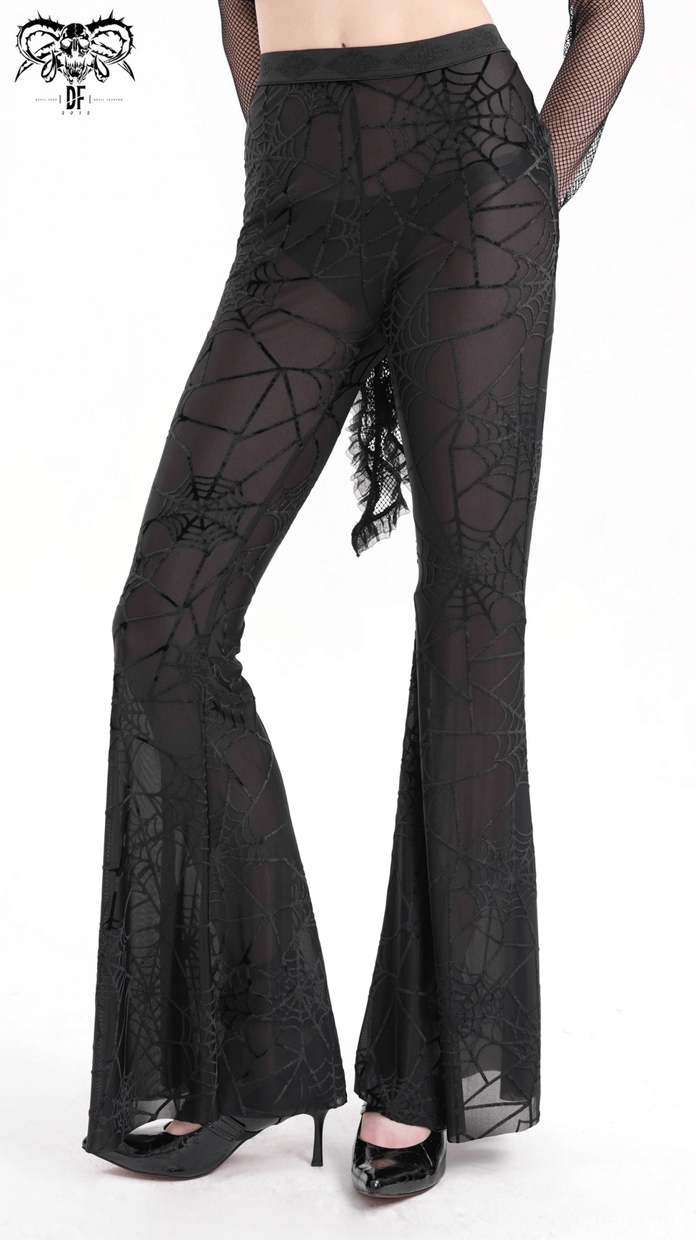 Black sheer spiderweb flare pants side profile - gothic mesh trousers showcasing high waist and drape