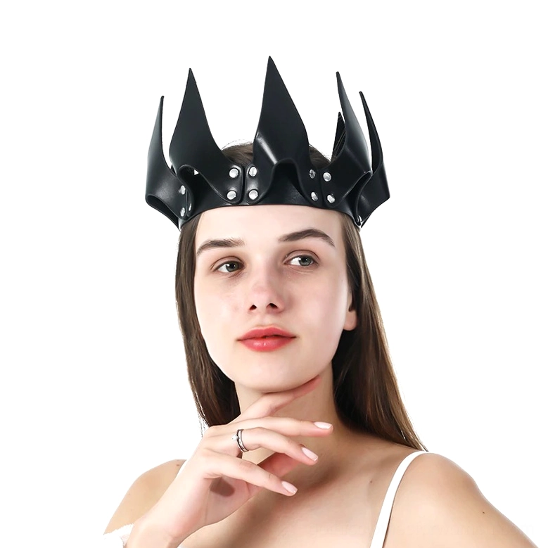 Black gothic spike rivet crown worn by model, front three-quarter view showcasing silver rivet details and architectural spike design on white background