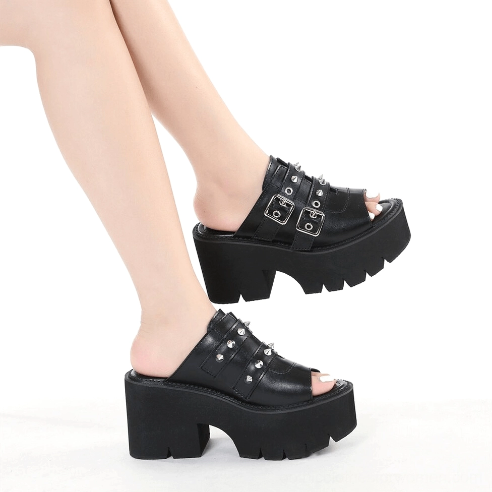 Black gothic spike sandal artistic angle view metal embellishments architectural heel