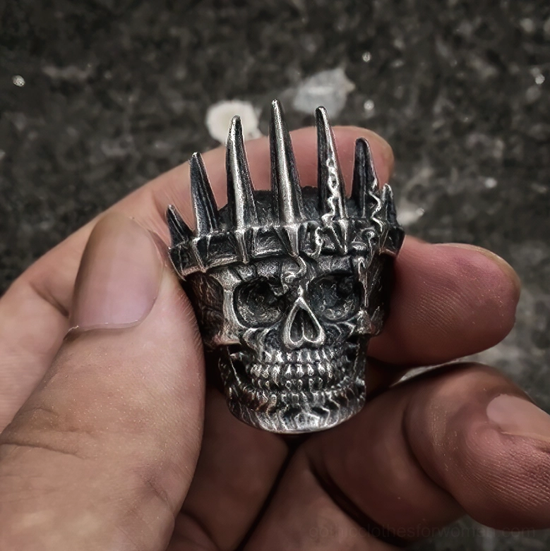 Spiked crown skull gothic ring top view matte vintage metal finish sharp crown spikes dark surface texture