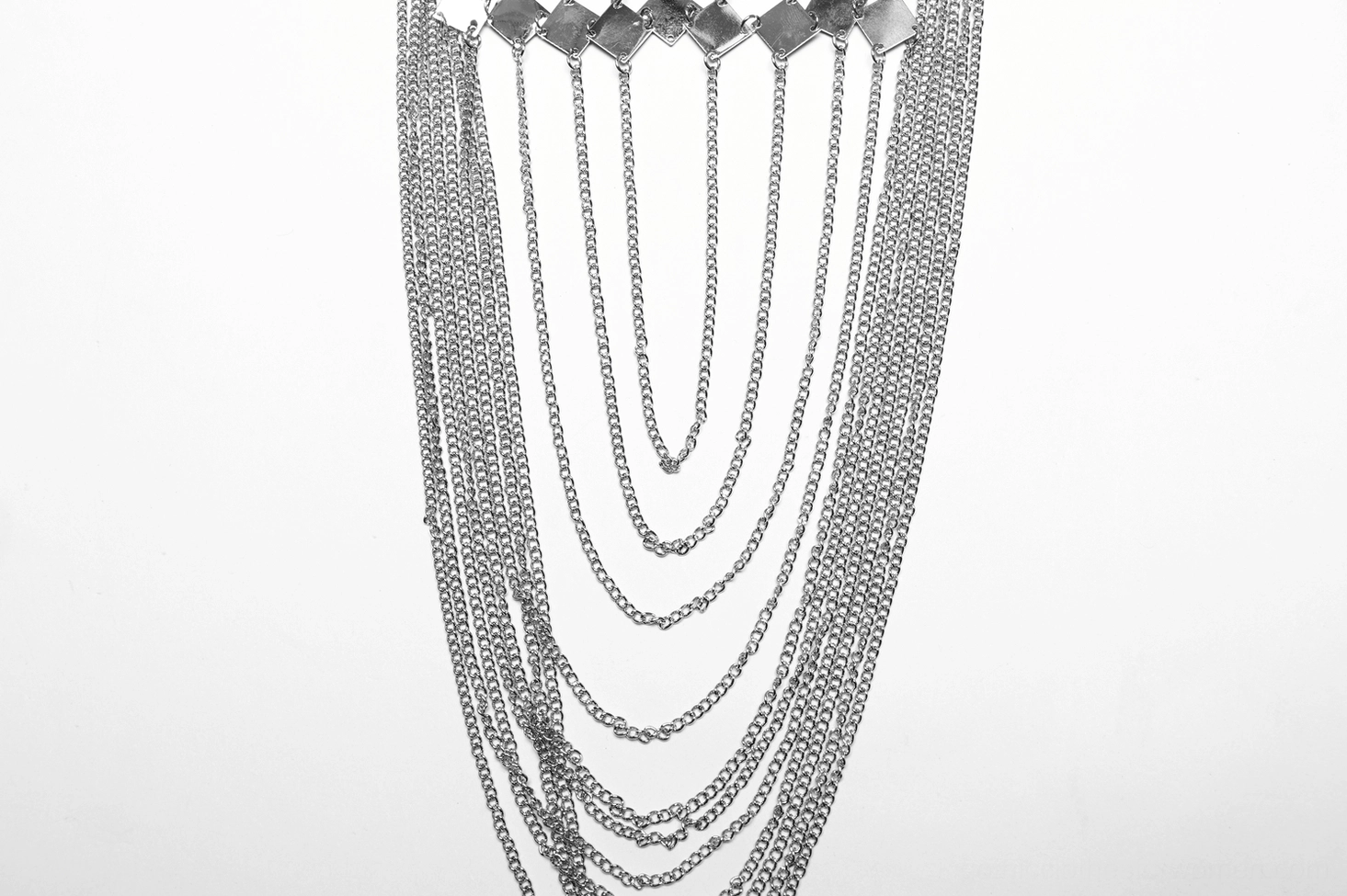 Gothic women's halter harness featuring spiked neck collar and silver chain embellishments