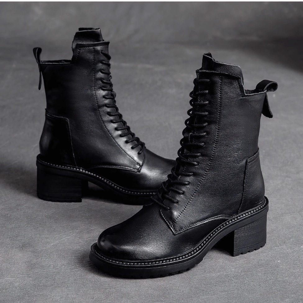 Gothic square heel leather ankle boots showcasing heel structure and height on white background