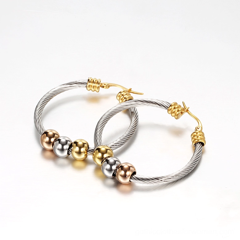 Twisted cable gothic hoop earrings overhead flat lay on white background with gold ear clasp hardware details