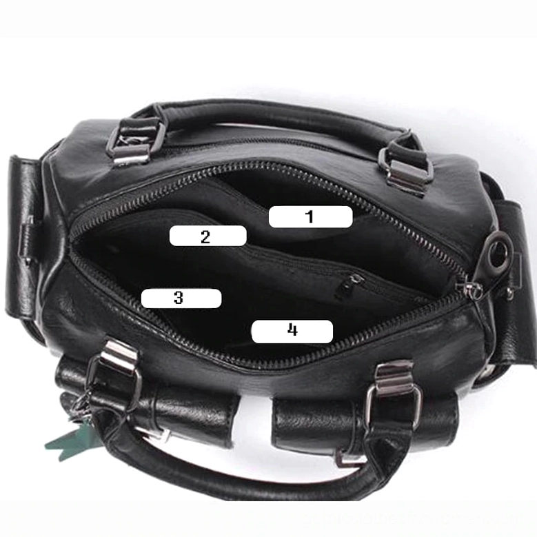 Gothic leather boston handbag with star pendant in lifestyle setting - alternative fashion accessory