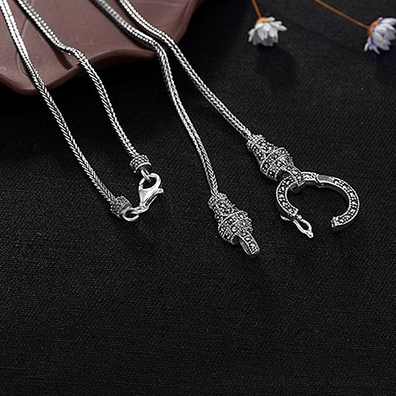 Pair of vintage S925 sterling silver gothic necklaces with oxidized finish and distinct clasp styles, floral styling