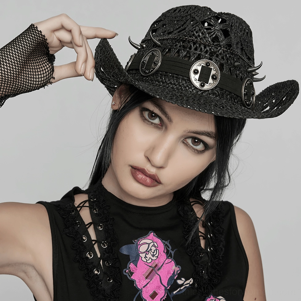 Front close-up of black gothic spike cowboy hat on model - woven straw texture and metal hardware
