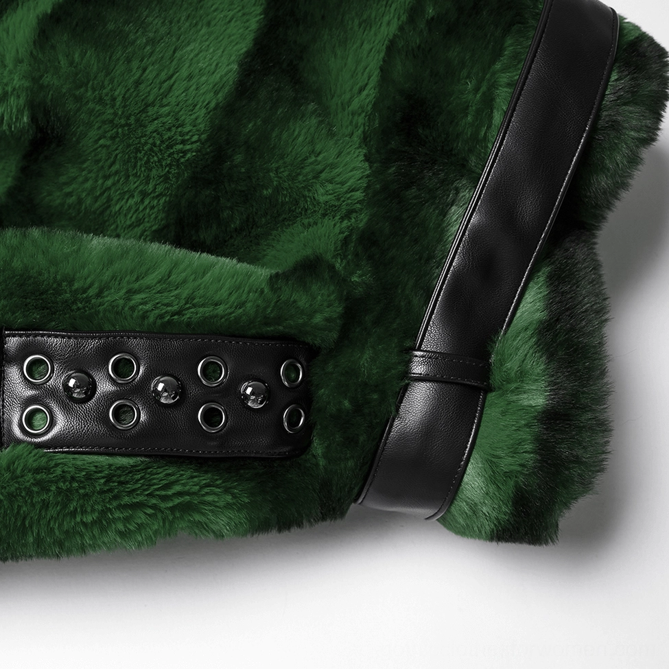 Detailed close-up of gothic jacket shoulder hardware showing studded leather shoulder strap with metal rivets attached to green striped faux fur base
