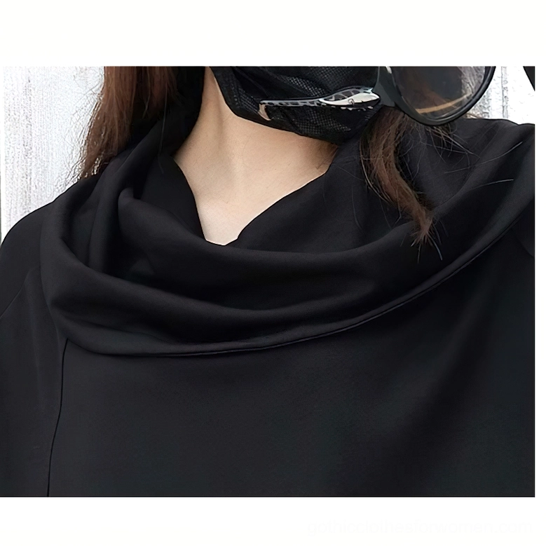 Close-up detail of black cowl neck collar on gothic sweatshirt showing draped wide neckline design
