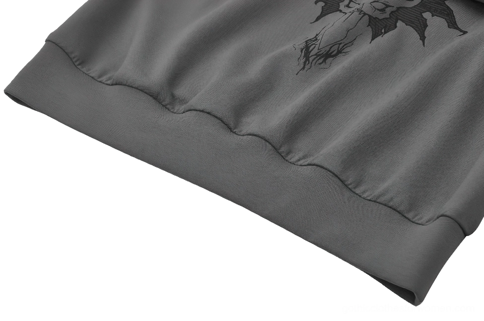 Close-up detail of ribbed knit cuff and hem on gothic sweatshirt showing fabric texture