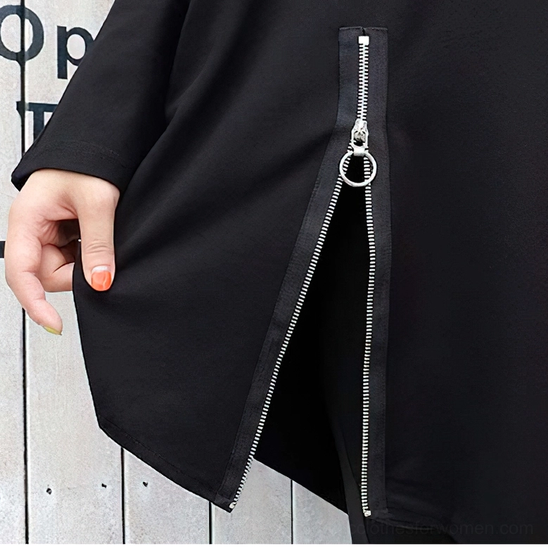 Close-up of side metal zipper with ring pull on asymmetrical gothic sweatshirt showing industrial hardware detail