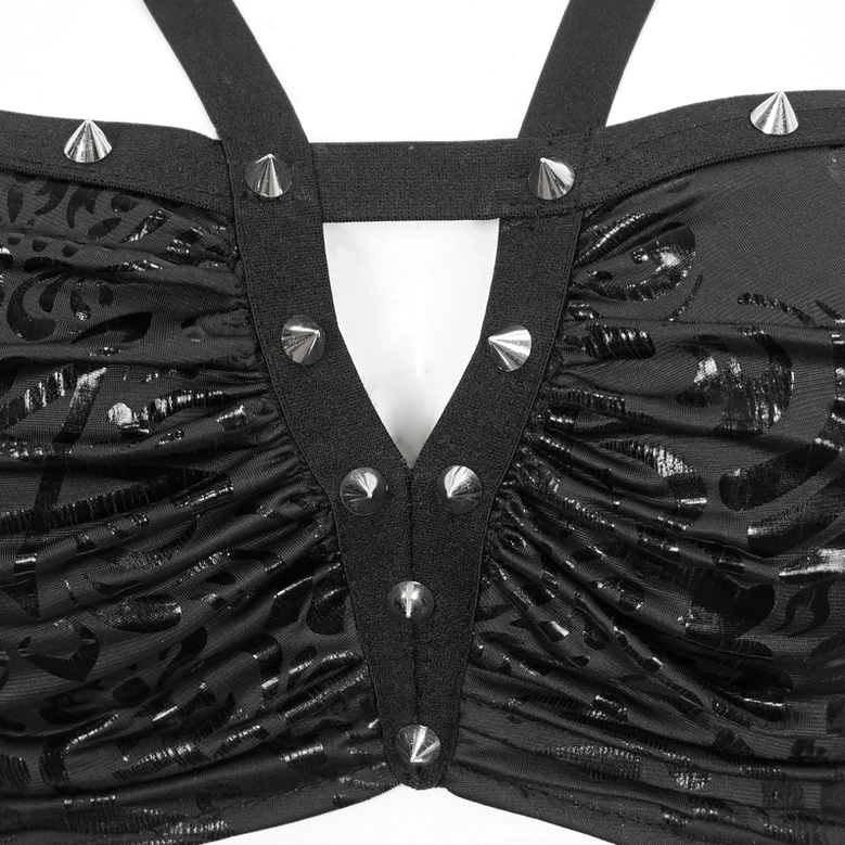 Close-up of gothic swimsuit bikini top showing silver cone studs and embossed floral pattern on ruched black fabric