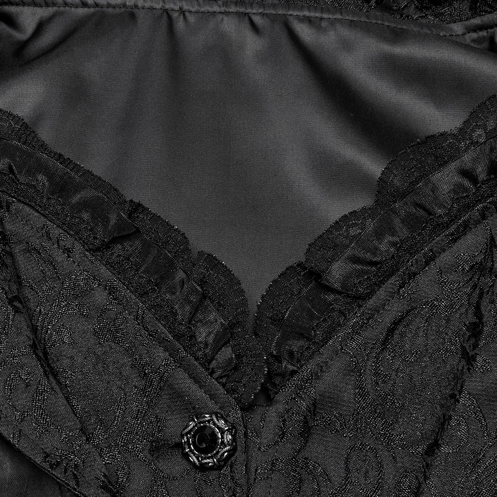 Close-up of gothic tailcoat neckline with lace ruffle trim and ornate button