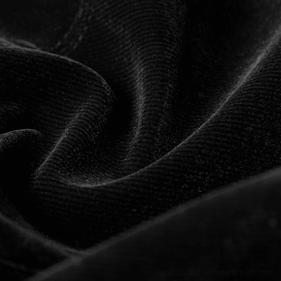 Embroidery pattern detail of gothic velvet tailcoat showing ornate black floral design on burgundy wine-red velvet base