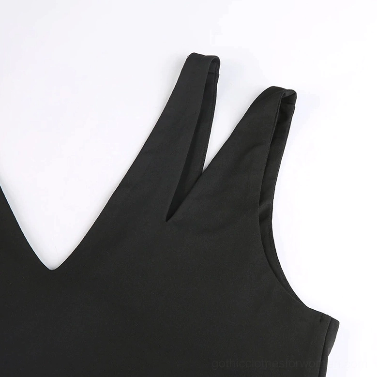 Close-up of single V-neck strap and stretch black fabric on gothic crop tank - neckline construction detail