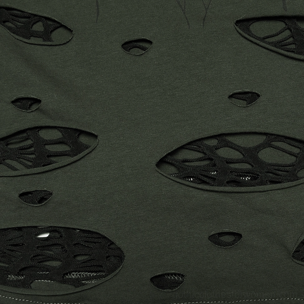 Distressed gothic mesh fabric detail - Close-up of dark knit fabric with hollow spider web cutout design