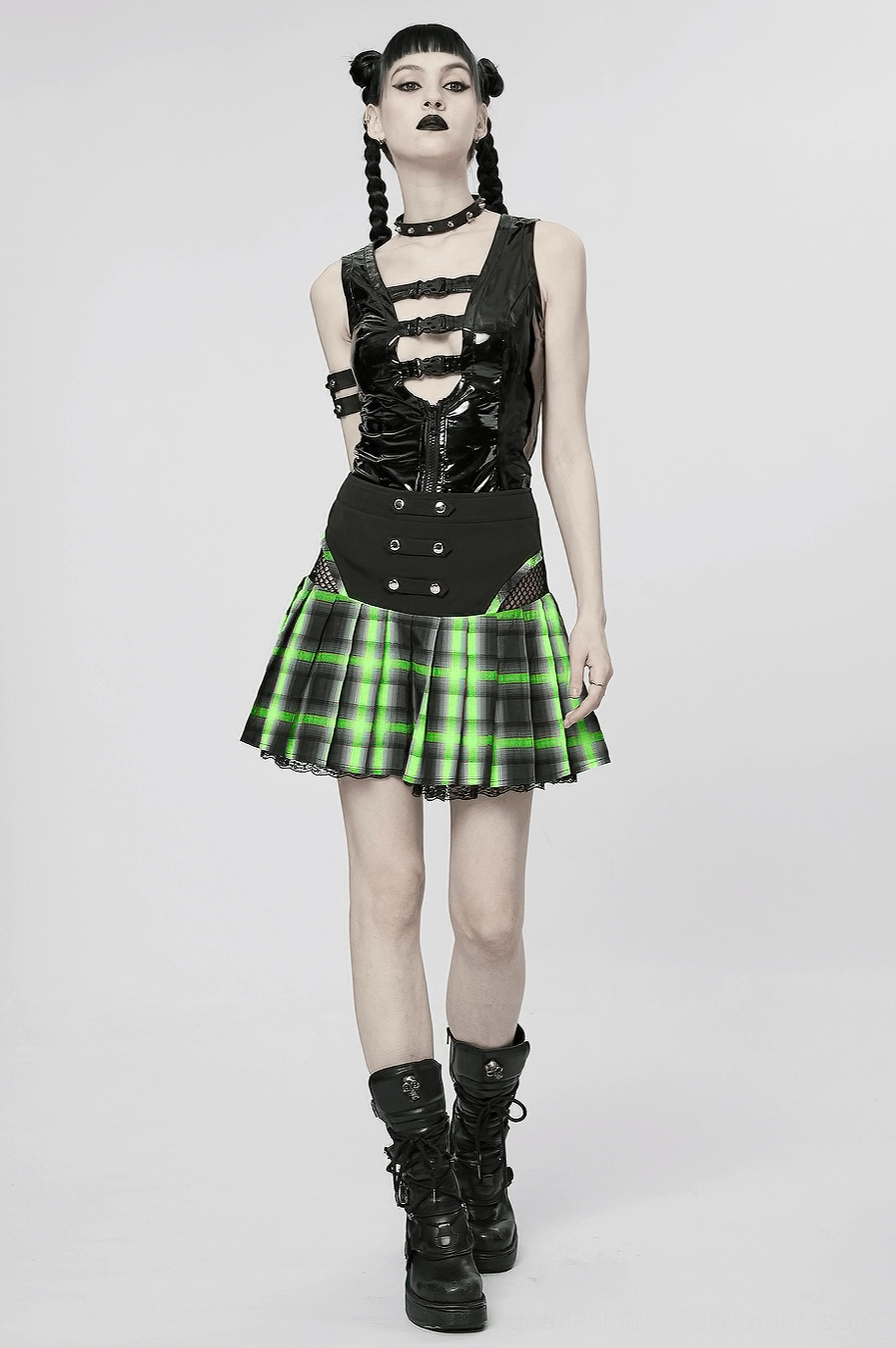 Alternative styling angle of black-green tartan gothic mini skirt on model in studio setting