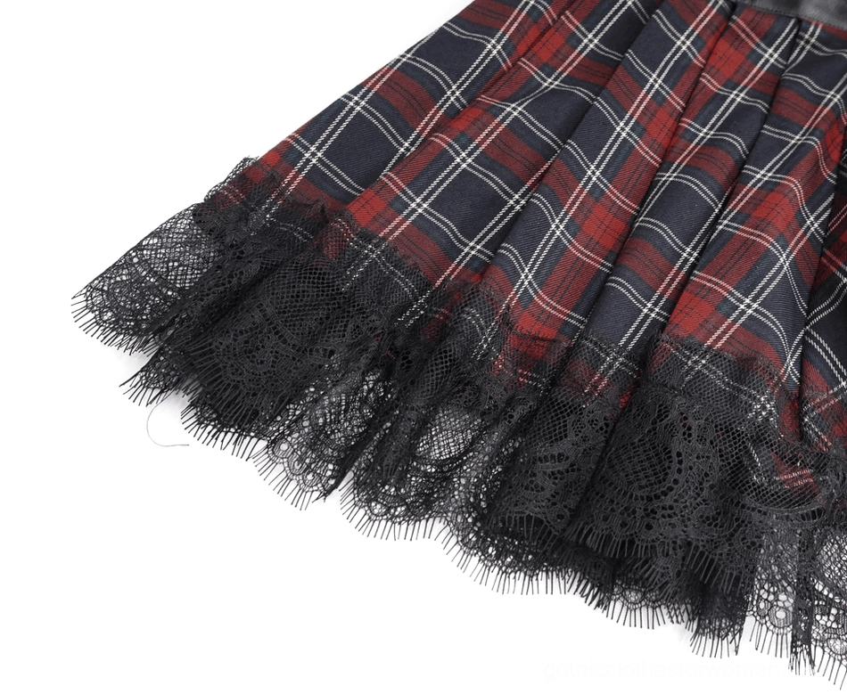 Gothic tartan plaid mini skirt flat lay, showing corset waist construction and mesh elements