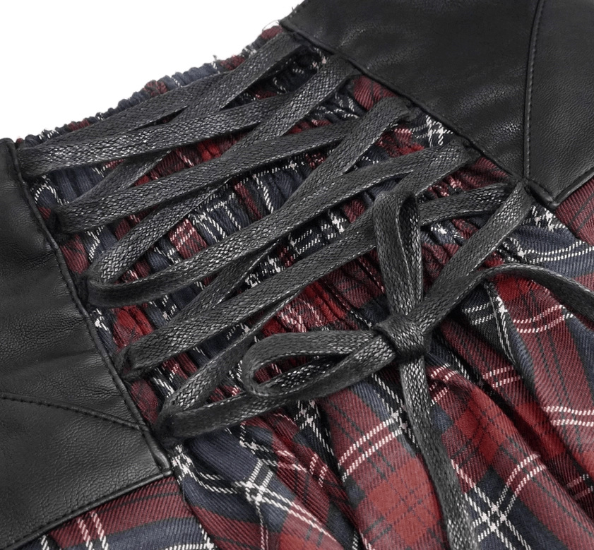 Gothic tartan skirt on model, front full-body view showing tartan pattern and chain details