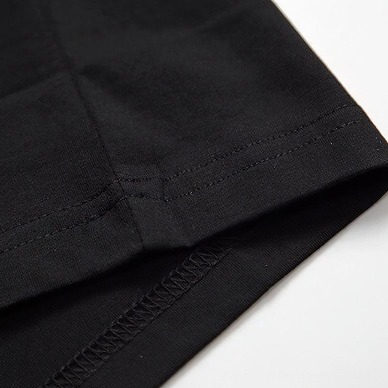 Sleeve hem and reinforced overlock stitching detail on gothic rhinestone skull t-shirt edge