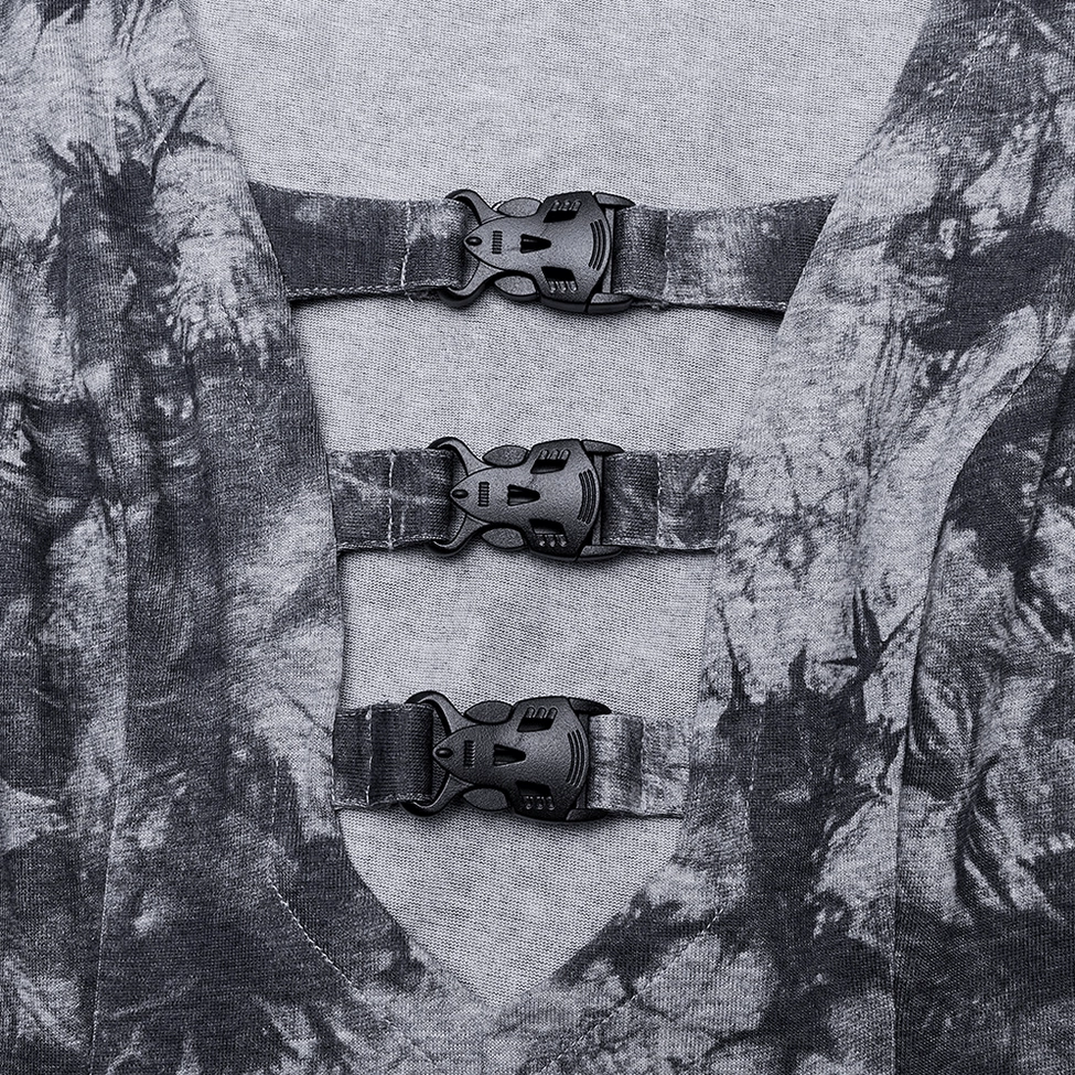 Close-up detail of triple black plastic buckles on soft gothic tie-dye knit fabric