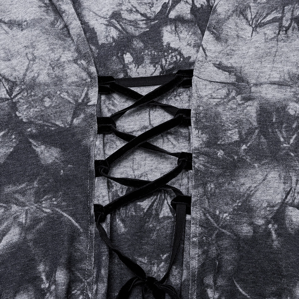 Close-up detail of black ribbon corset lace-up back design on gothic tie-dye dress