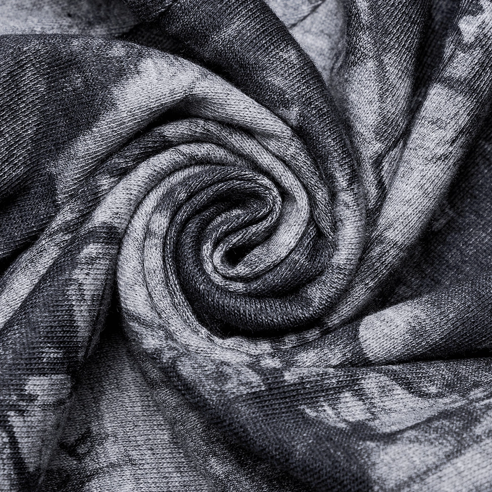 Fabric close-up showing soft stretch knit texture with spiral tie-dye pattern in dark grey