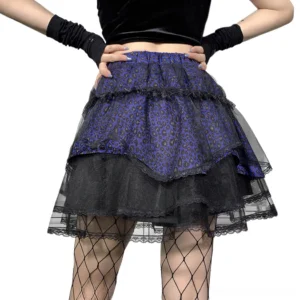 Closeup waist-down view of asymmetrical tiered ruffle gothic skirt with elastic waistband and black tulle hem