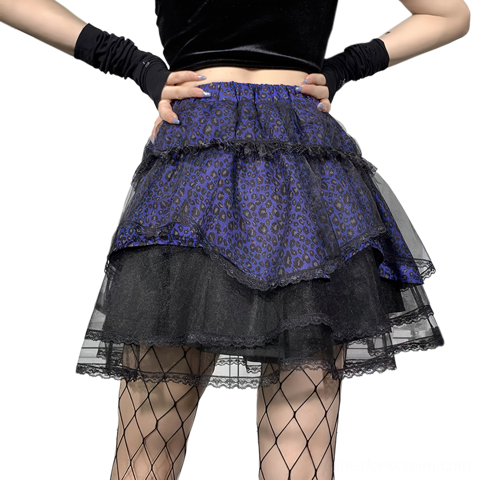 Closeup waist-down view of asymmetrical tiered ruffle gothic skirt with elastic waistband and black tulle hem
