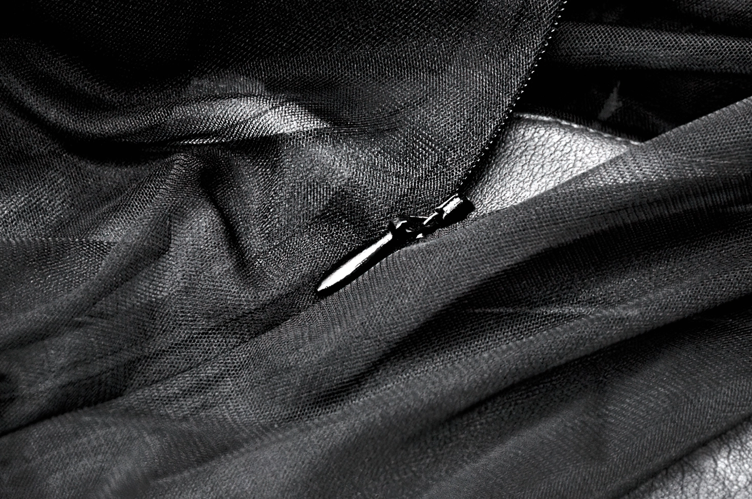 Black tiered tulle gothic dress showing ruffled neckline and dramatic volume of the tiered skirt construction
