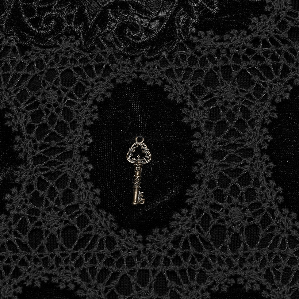 Antique gold key pendant detail on black velvet gothic top with intricate lace weave design